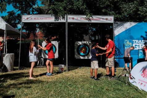 Children try out archery at the Canadian Tire sport demonstration.