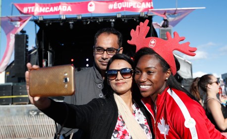 Khamica Bingham takes a picture with fans on Canada day at Beach Party.