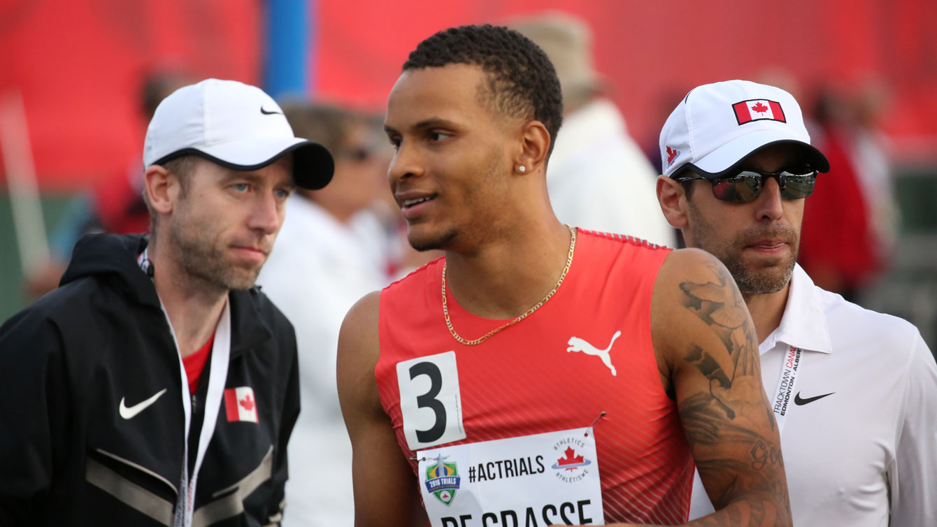 Andre De Grasse (centre) after winning the men's 100m at Athletics Canada Olympic trials on July 9, 2016.