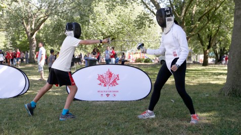 Canadian Tire helps children try out fencing at the Beach Party.