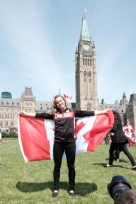 Rosie MacLennan holding the Canadian Flag after being named Canada's flag bearer for Rio 2016. July 21, 2016 in Ottawa. (Thomas Skrlj/COC)