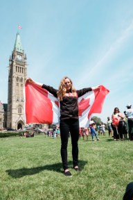 Rosie MacLennan holding the Canadian Flag after being named Canada's flag bearer for Rio 2016. July 21, 2016 in Ottawa. (Thomas Skrlj/COC)