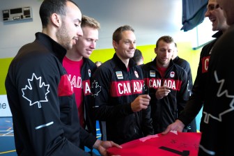 The Canadian Men's VOlleyball team signing a jersey on July 22, 2016. (Thomas Skrlj/COC)