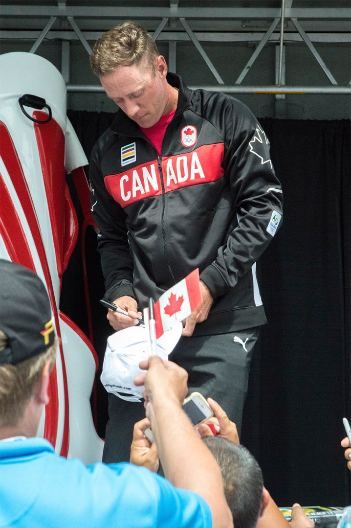 Graham DeLaet signs autographs for fans during the Rio 2016 Team Canada announcement on July 19, 2016. (Tavia Bakowski/COC)