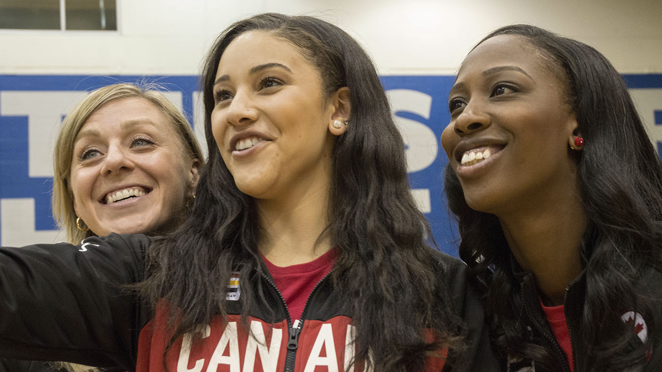 Lizanne Murphy, Natalie Achonwa and Tamara Tatham take a snapchat at the Team Canada Basketball announcement on July 22, 2016. (Tavia Bakowski/COC)