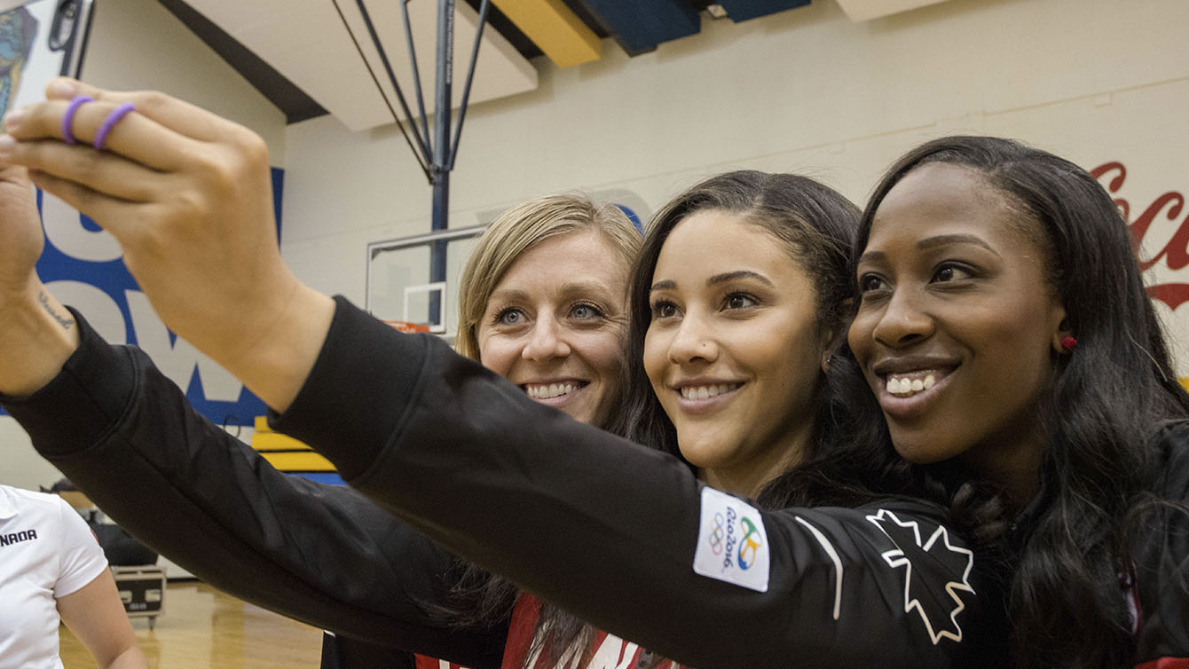 Lizanne Murphy, Natalie Achonwa and Tamara Tatham take a selfie at the Team Canada Basketball announcement on July 22, 2016. (Tavia Bakowski/COC)