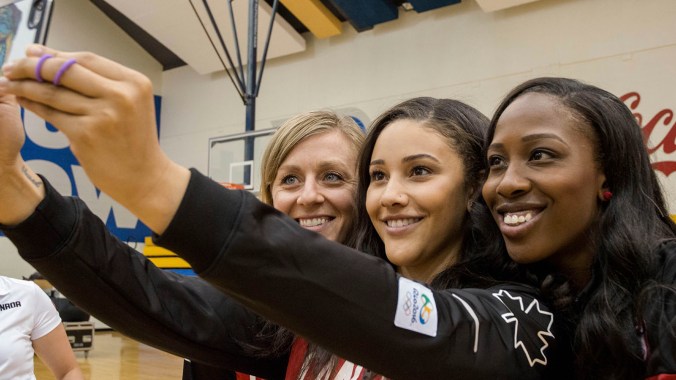 Lizanne Murphy, Natalie Achonwa and Tamara Tatham take a selfie at the Team Canada Basketball announcement on July 22, 2016. (Tavia Bakowski/COC)