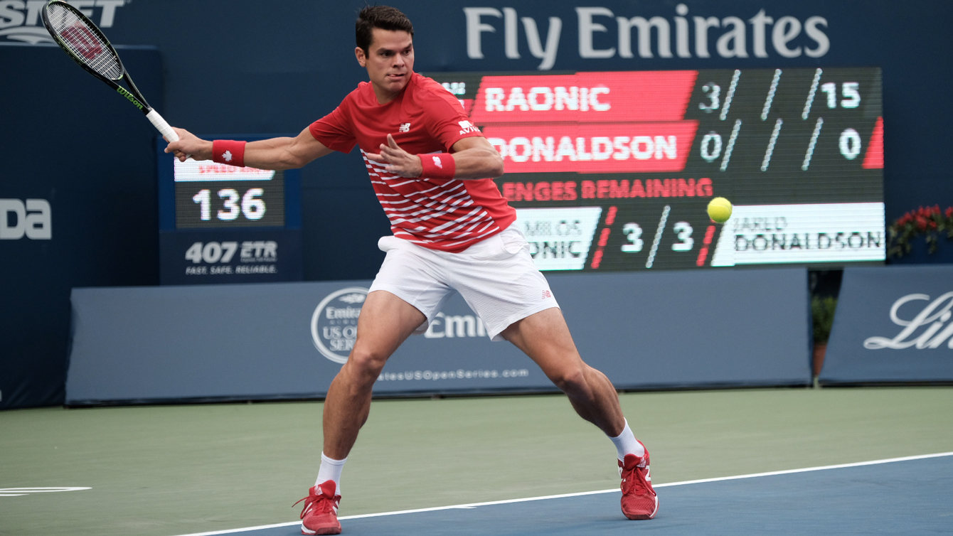 Milos Raonic returns a ball against Jared Donaldson at the Rogers Cup in Toronto on July 28, 2016. (Thomas Skrlj/COC)