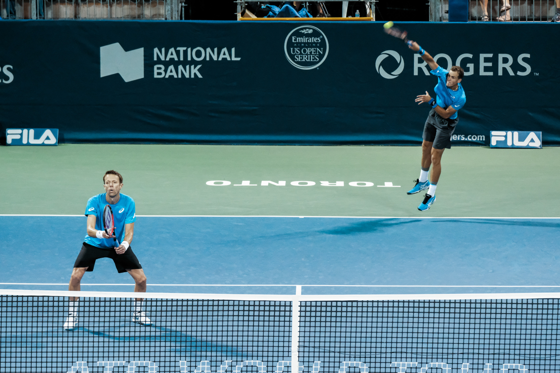Canada’s Vasek Pospisil and Daniel Nestor play doubles in the quarterfinals of the Rogers Cup in Toronto on July 29, 2016. (Thomas Skrlj/COC)