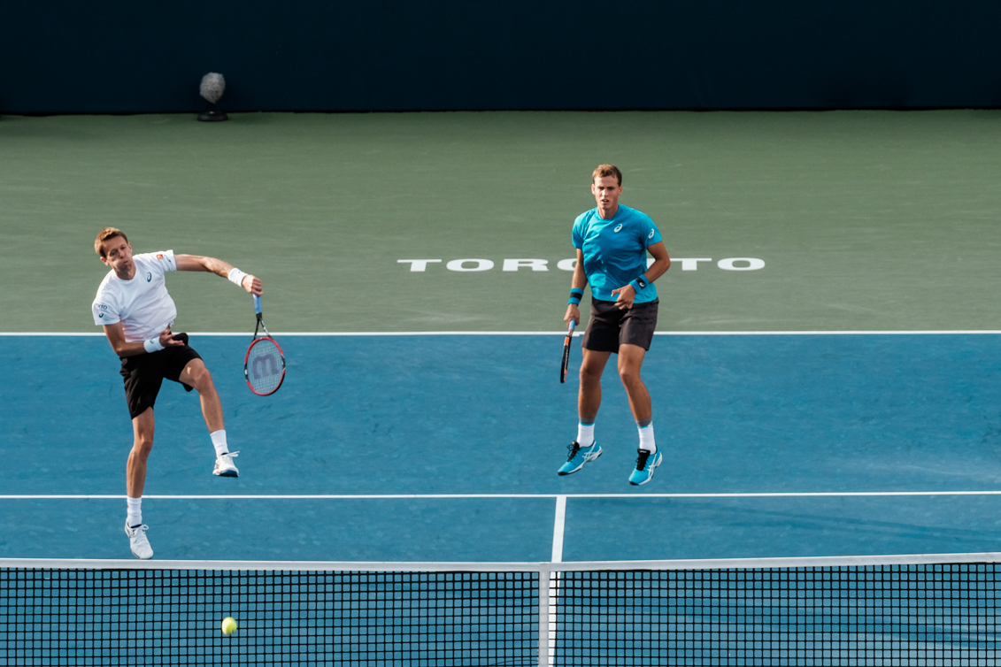 Canada’s Vasek Pospisil and Daniel Nestor play doubles in the semifinals of the Rogers Cup in Toronto on July 30, 2016. (Thomas Skrlj/COC)