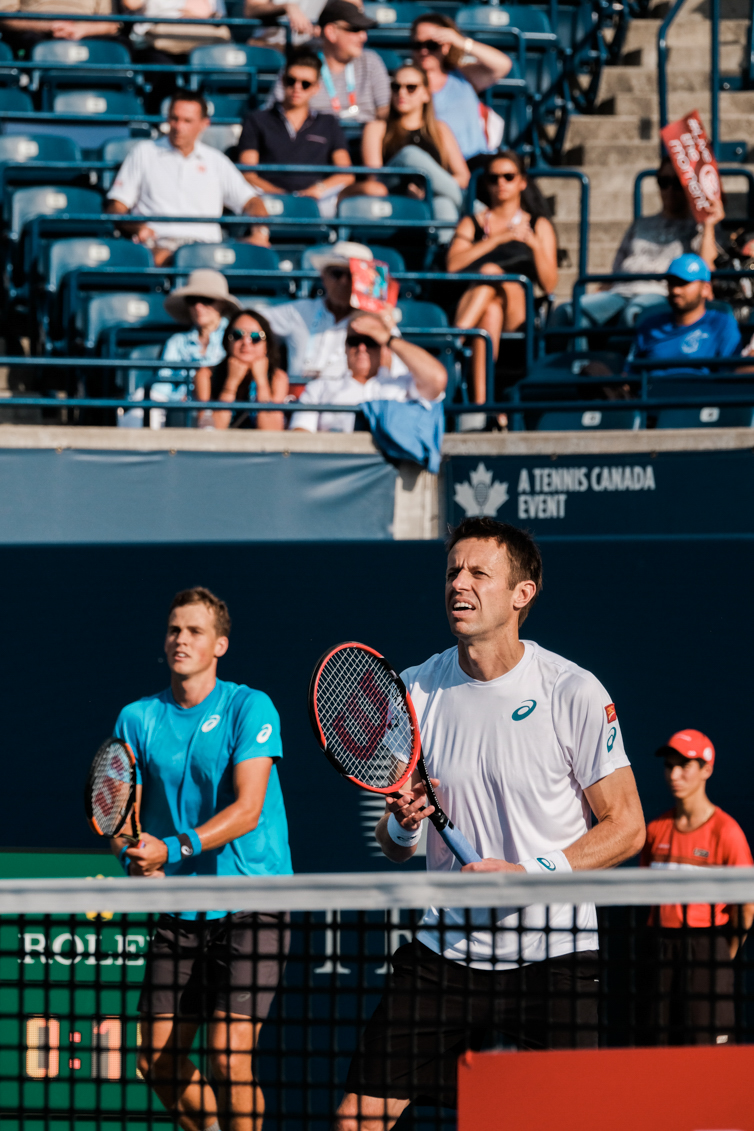 Canada’s Vasek Pospisil and Daniel Nestor play doubles in the semifinals of the Rogers Cup in Toronto on July 30, 2016. (Thomas Skrlj/COC)