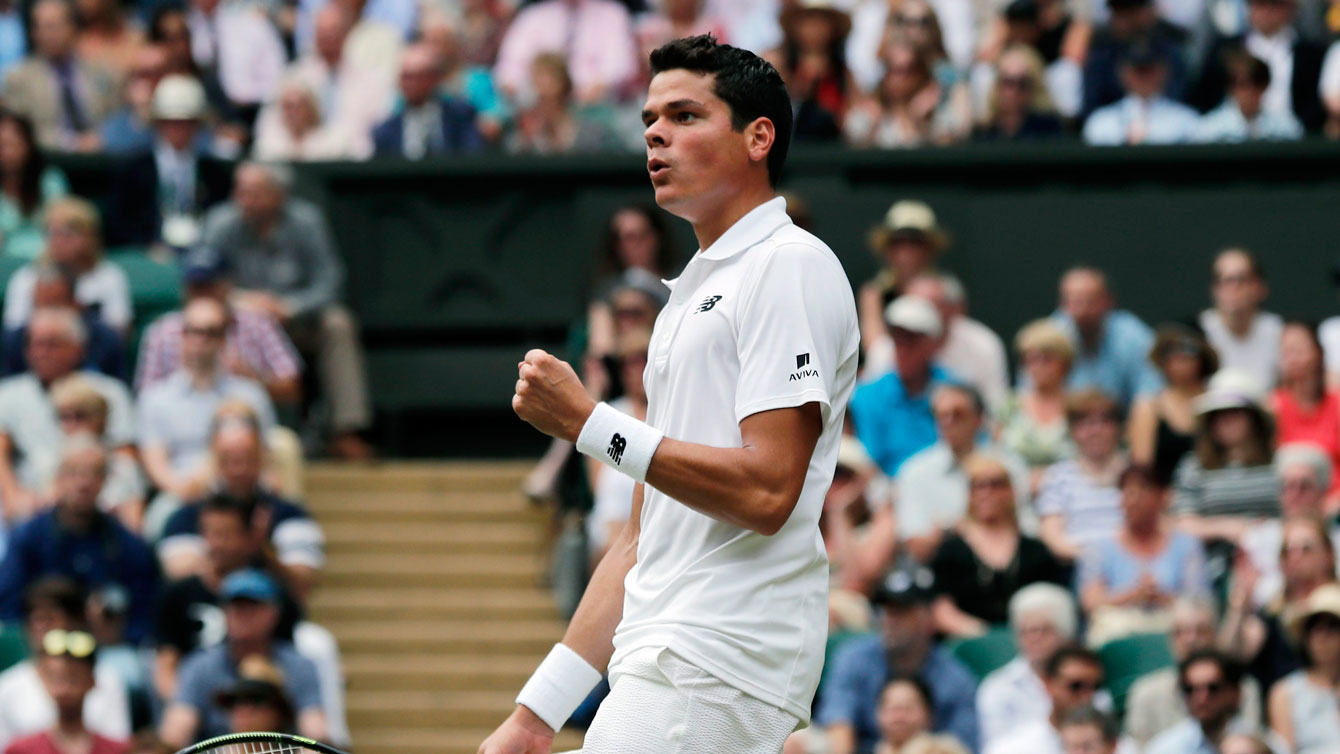 Milos Raonic celebrates a point against Roger Federer at their Wimbledon semifinal on July 8, 2016. 