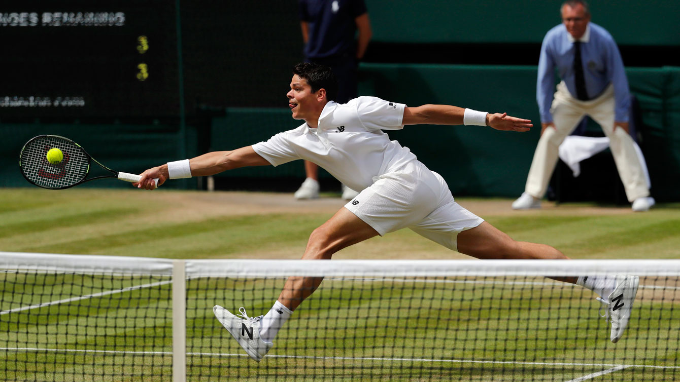 Milos Raonic reaches for the ball against Andy Murray at Wimbledon final on July 10, 2016.