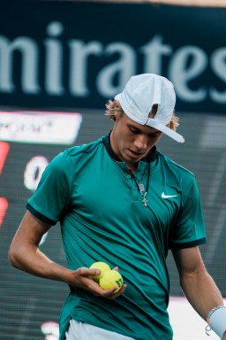 Denis holding tennis balls