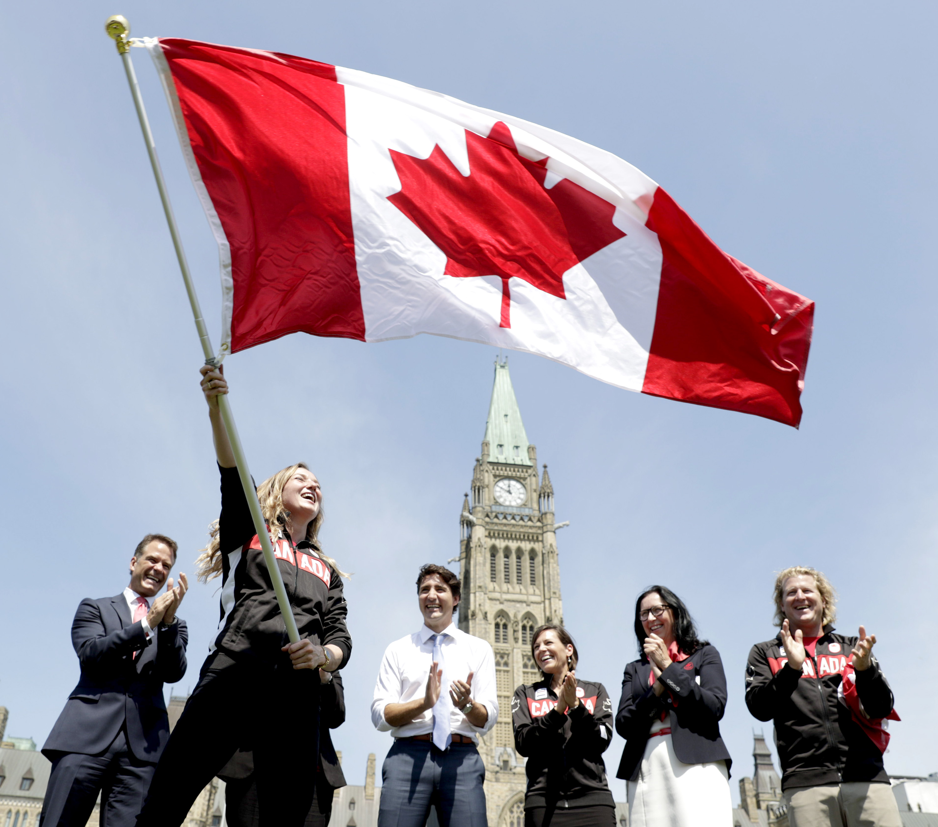 Rosie MacLennan waves the Canadian flag after being named Team Canada Flagbearer for Rio 2016 on July 21. 2016.