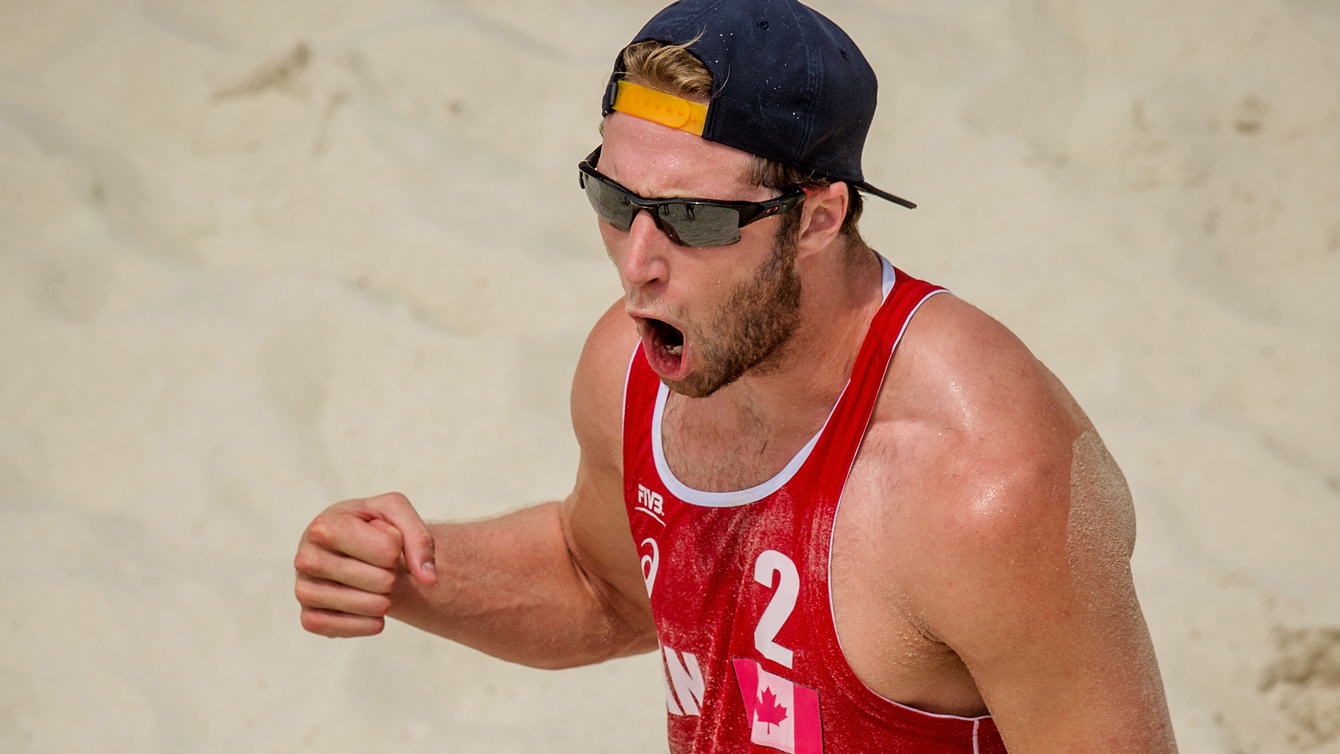 Sam Schachter of Canada celebrates a point at the Olympic qualification tournament in Sochi. (Photo: FIVB)