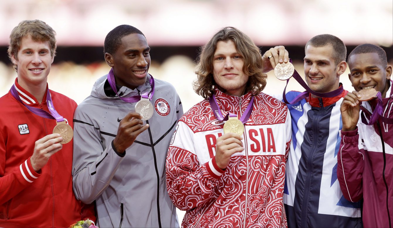 Medalists in the men's high jump, from left, Canada's Derek Drouin, bronze, United States' Erik Kynard, silver, Russia's Ivan Ukhov, gold, Britain's Robert Grabarz , bronze, and Qatar's Mutaz Essa Barshim, bronze, pose for photographers during the athletics in the Olympic Stadium at the 2012 Summer Olympics, London, Wednesday, Aug. 8, 2012.(AP Photo/Ben Curtis)