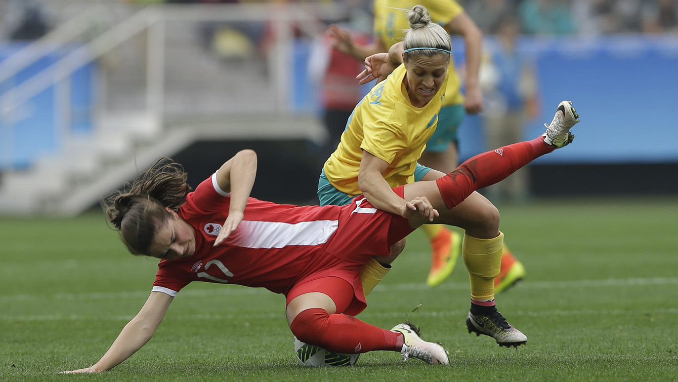 Australia's Katrina Gorry, top, fights for the ball with Canada's Jessie Fleming during the 2016 Summer Olympics football match at the Arena Corinthians in Sao Paulo, Brazil, Wednesday, Aug. 3, 2016. (AP Photo/Nelson Antoine)