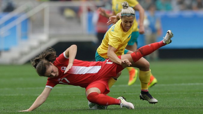 Australia's Katrina Gorry, top, fights for the ball with Canada's Jessie Fleming during the 2016 Summer Olympics football match at the Arena Corinthians in Sao Paulo, Brazil, Wednesday, Aug. 3, 2016. (AP Photo/Nelson Antoine)