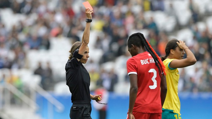 Referee Stephanie Frappart, left, gives Canada's Shelina Zadorsky, not seen in the photo, a red card during the 2016 Summer Olympics football match between Canada and Australia, at the Arena Corinthians in Sao Paulo, Brazil, Wednesday, Aug. 3, 2016. (AP Photo/Nelson Antoine)