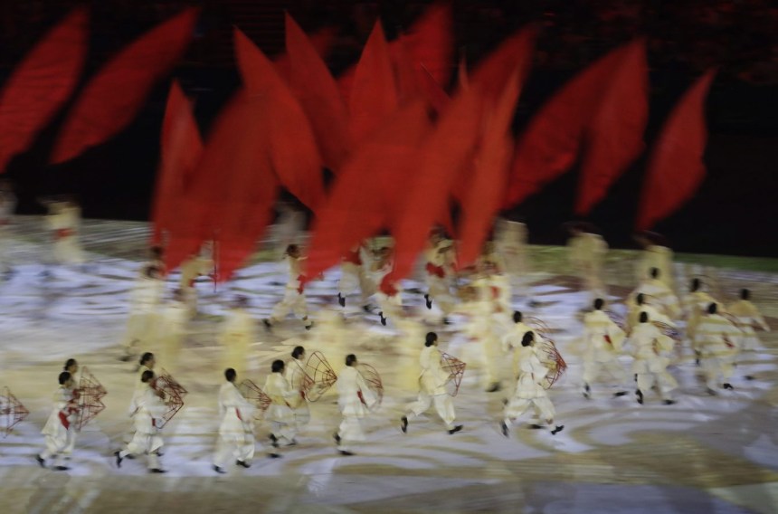 In this photo taken with slow shutter speed artists perform during the opening ceremony for the 2016 Summer Olympics in Rio de Janeiro, Brazil, Friday, Aug. 5, 2016. (AP Photo/Dmitri Lovetsky)