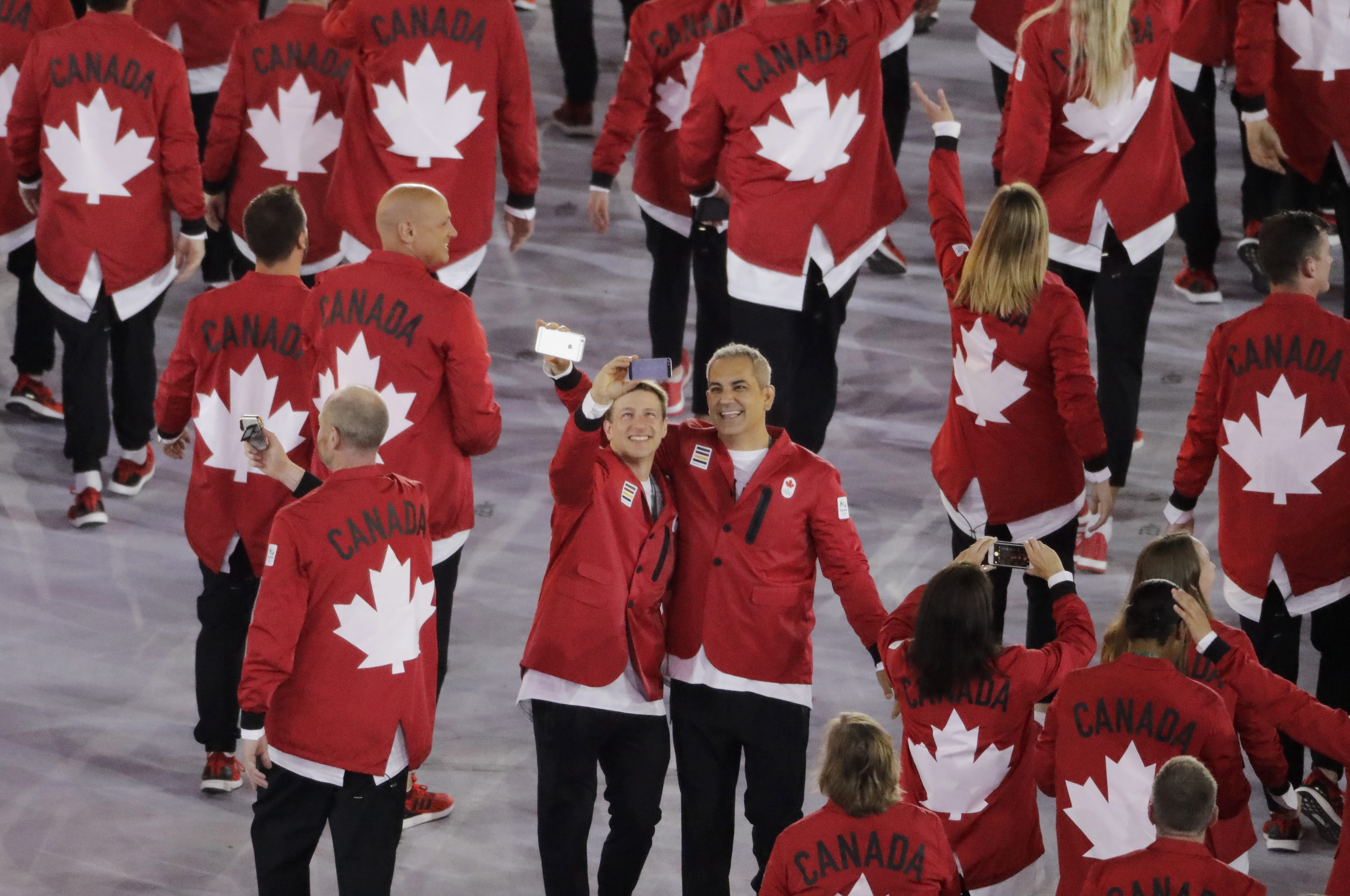 Members of team Canada take a selfie during the opening ceremony of the 2016 Summer Olympics in Rio de Janeiro, Brazil, Friday, Aug. 5, 2016. (AP Photo/Charlie Riedel)