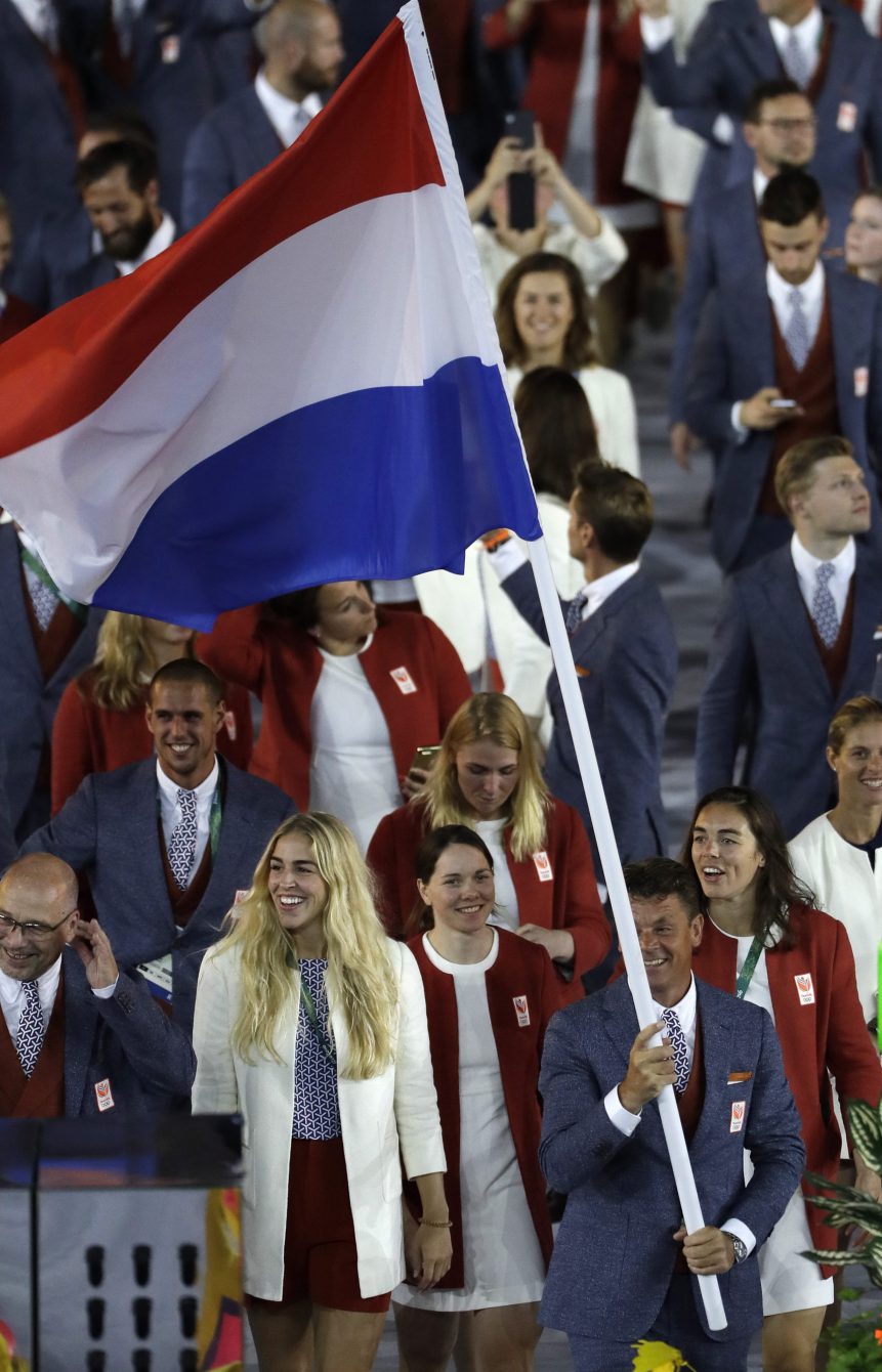 Jeroen Dubbeldam carries the flag of the Netherlands during the opening ceremony for the 2016 Summer Olympics in Rio de Janeiro, Brazil, Friday, Aug. 5, 2016. (AP Photo/Matt Slocum)