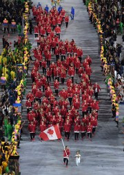 Rosannagh Maclennan carries the flag of Canada during the opening ceremony for the 2016 Summer Olympics in Rio de Janeiro, Brazil, Friday, Aug. 5, 2016. (Richard Heathcote/Pool Photo via AP)
