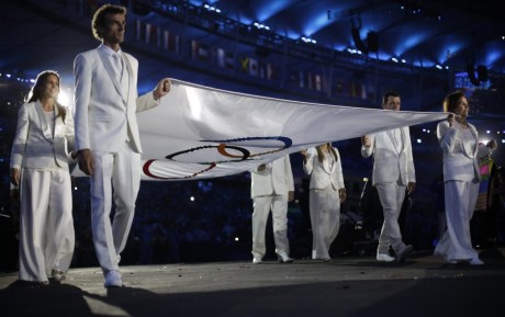 Flag bearers carry the Olympic flag during the opening ceremony for the 2016 Summer Olympics in Rio de Janeiro, Brazil, Friday, Aug. 5, 2016. (AP Photo/David Goldman)