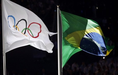 The Olympic and Brazilian flag fly during the opening ceremony for the 2016 Summer Olympics Friday. AP/Matthias Schrader