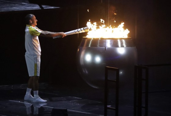 Vanderlei de Lima lights the Olympic flame during the opening ceremony for the 2016 Summer Olympics. AP Photo/Jae C. Hong