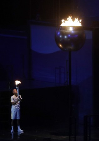 Vanderlei de Lima lights the Olympic flame during the opening ceremony for the 2016 Summer Olympics in Rio de Janeiro, Brazil, Friday, Aug. 5, 2016. (AP Photo/Jae C. Hong)