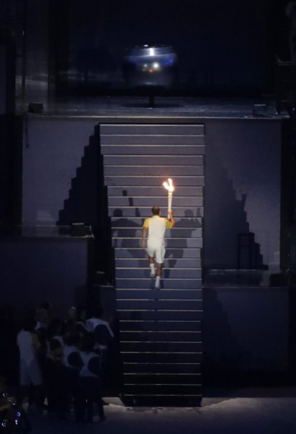 Rio Olympics Opening Ceremony Brazilian marathoner Vanderlei de Lima lights the Olympic flame during the opening ceremony for the 2016 Summer Olympics in Rio de Janeiro, Brazil, Friday, Aug. 5, 2016. (AP Photo/Matthias Schrader)