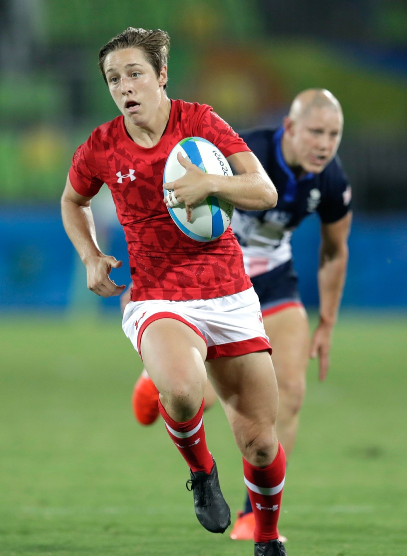 Canada's Ghislaine Landry, runs away from Great Britain's Heather Fisher, to score a try during the women's rugby sevens bronze medal match at the Summer Olympics in Rio de Janeiro, Brazil, Monday, Aug. 8, 2016. (AP Photo/Themba Hadebe)