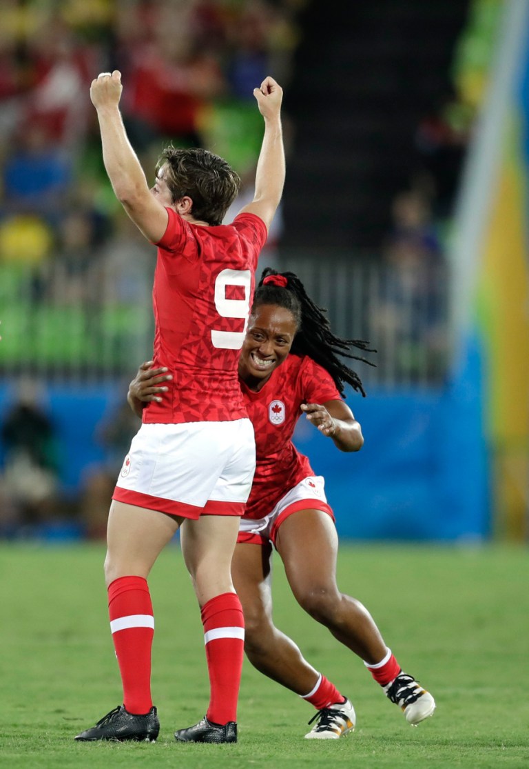 Canada's Charity Williams, right, celebrates with teammate Ghislaine Landry, after winning the the women's rugby sevens bronze medal match against Great Britain at the Summer Olympics in Rio de Janeiro, Brazil, Monday, Aug. 8, 2016. (AP Photo/Themba Hadebe)