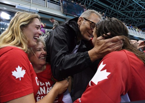 OLY SWM Canada 20160811 Canada's Penny Oleksiak, right, celebrates with a kiss from her father as her sister and mom look on following her gold-medal performance at the women's 100m freestyle finals during the 2016 Olympic Summer Games in Rio de Janeiro, Brazil, on Friday, Aug. 12, 2016. THE CANADIAN PRESS/Sean Kilpatrick