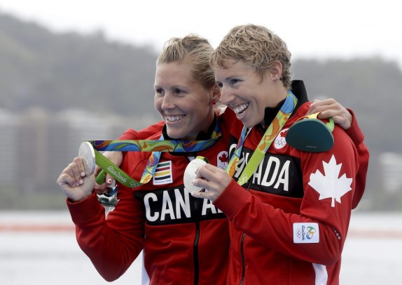 Lindsay Jennerich and Patricia Obee of Canada, show their silver medals after the women's rowing lightweight double sculls final during the 2016 Summer Olympics in Rio de Janeiro, Brazil, Friday, Aug. 12, 2016. (AP Photo/Luca Bruno)