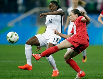 Canada's Allysha Chapman, right, and France's Kadidiatou Diani fight for the ball during a quarter-final match of the women's Olympic football tournament between Canada and France in Sao Paulo, Brazil, Friday Aug. 12, 2016.(AP Photo/Nelson Antoine)