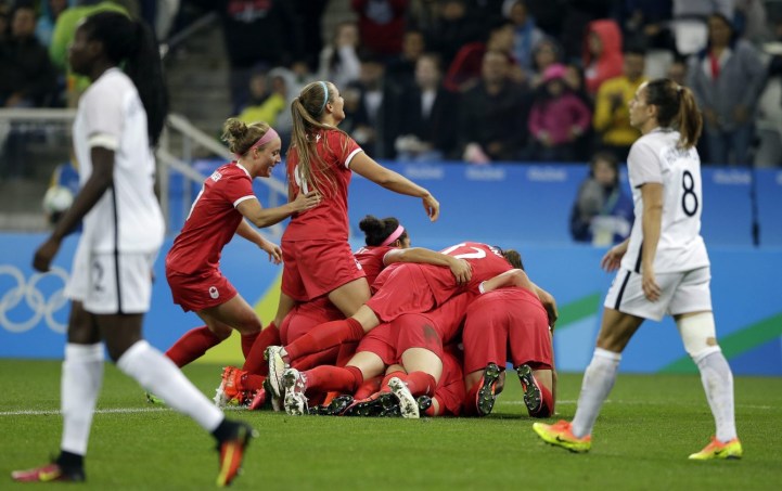 Canada's players celebrate after Sophie Schmidt scored her team's first goal during a quarter-final match of the women's Olympic football tournament between Canada and France in Sao Paulo, Brazil, Friday Aug. 12, 2016.(AP Photo/Nelson Antoine)