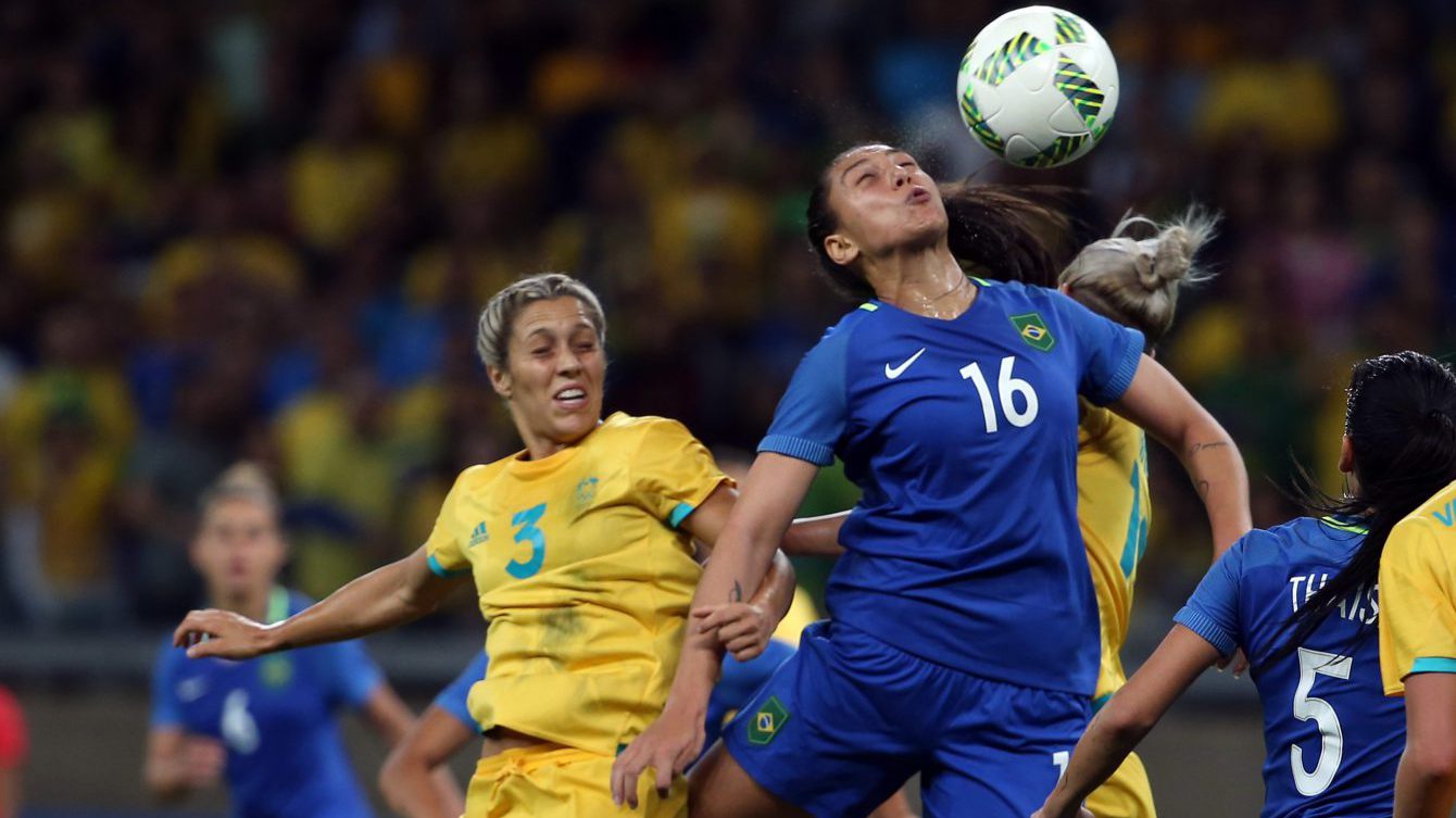 Brazil's Beatriz, 16, jumps for a header past Australia's Katrina Gorry, left, during a quarter-final match of the women's Olympic football tournament between Brazil and Australia at the Mineirao Stadium in Belo Horizonte, Brazil, Friday Aug. 12, 2016. (AP Photo/Eugenio Savio)