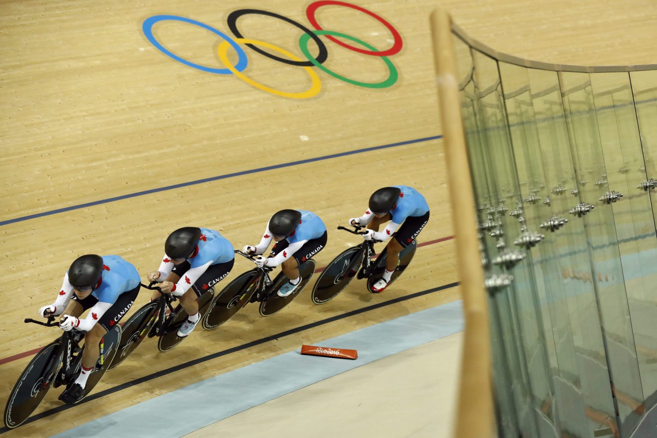 Canada's team compete in the women's team pursuit first round at the Rio Olympic Velodrome during the 2016 Summer Olympics in Rio de Janeiro, Brazil, Saturday, Aug. 13, 2016. (AP Photo/Patrick Semansky)