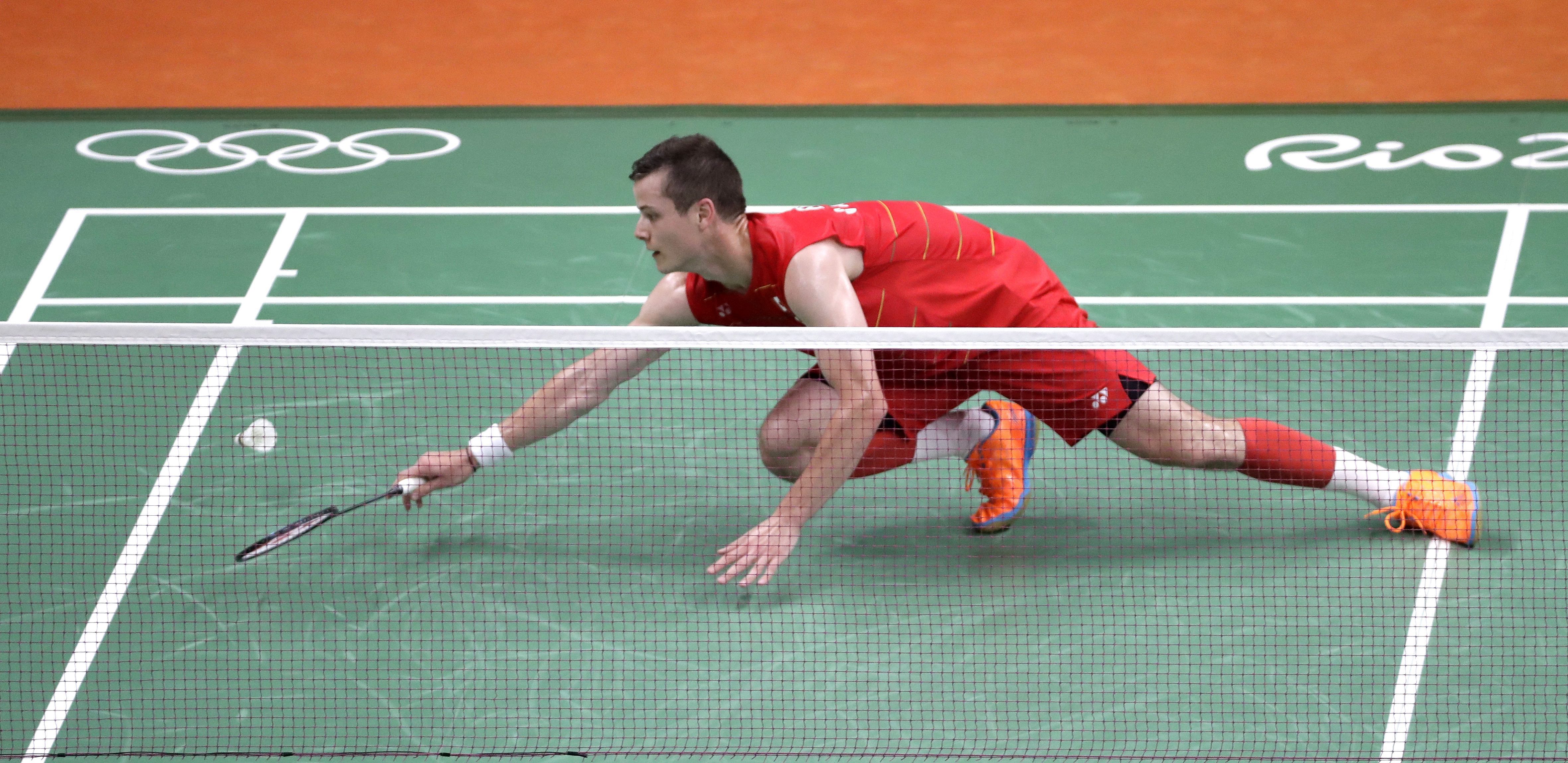 Canada's Martin Giuffre tries to return a shot to Portugal's Pedro Martins during a men's singles badminton match at the 2016 Summer Olympics in Rio de Janeiro, Brazil, Saturday, Aug. 13, 2016. (AP Photo/Mark Humphrey)