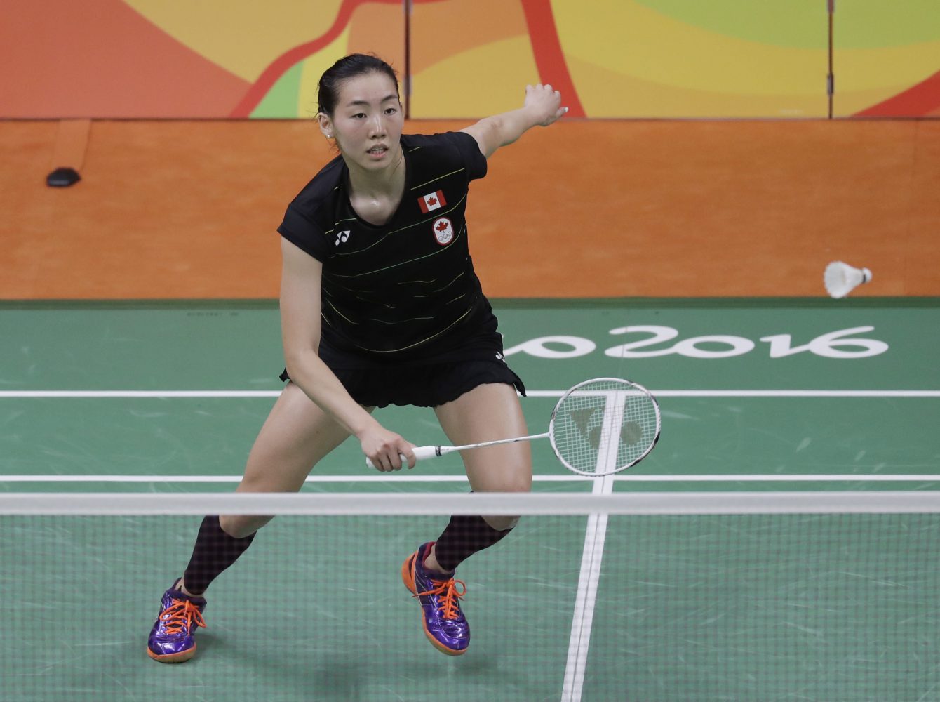 Canada's Michelle Li returns a shot to Hungary's Laura Sarosi during a Women's single match at the 2016 Summer Olympics in Rio de Janeiro, Brazil, Saturday, Aug. 13, 2016. (AP Photo/Kin Cheung)
