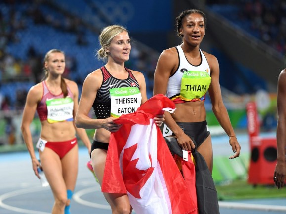 Canada's Brianne Theisen-Eaton, left, celebrates her bronze medal finish in front of gold medallist Nafissatou Thiam, of Belgium, in the women's heptathlon at the 2016 Olympic Games in Rio de Janeiro, Brazil on Saturday, Aug. 13, 2016. THE CANADIAN PRESS/Ryan Remiorz