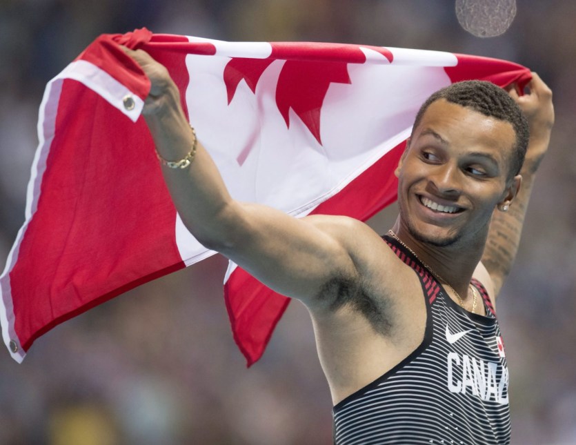 Canada's Andre De Grasse celebrates bronze in the men's 100-metre final during the athletics competition at the 2016 Olympic Summer Games in Rio de Janeiro, Brazil on Sunday, August 14, 2016. THE CANADIAN PRESS/Frank Gunn