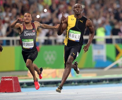 Rio 2016: Andre De Grasse 100m final bronze Jamaica's Usain Bolt celebrates as he crosses the line to win gold in the men's 100-meter final with Canada's Andre de Grasse during the athletics competitions of the 2016 Summer Olympics at the Olympic stadium in Rio de Janeiro, Brazil, Sunday, Aug. 14, 2016. (AP Photo/Lee Jin-man)