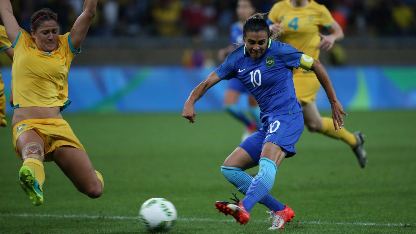 Brazil's Marta, right, shoots as Australia's Katrina Gorry tries to block during a quarter-final Olympic women's soccer match at the Mineirao Stadium in Belo Horizonte, Brazil. (AP Photo/Eugenio Savio)