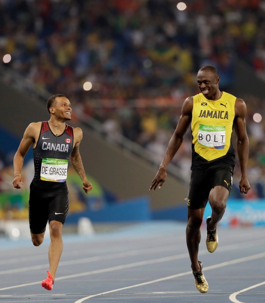 Jamaica's Usain Bolt, right, and Canada's Andre De Grasse compete in a men's 200-meter semifinal during the athletics competitions of the 2016 Summer Olympics at the Olympic stadium in Rio de Janeiro, Brazil, Wednesday, Aug. 17, 2016. (AP Photo/David J. Phillip)