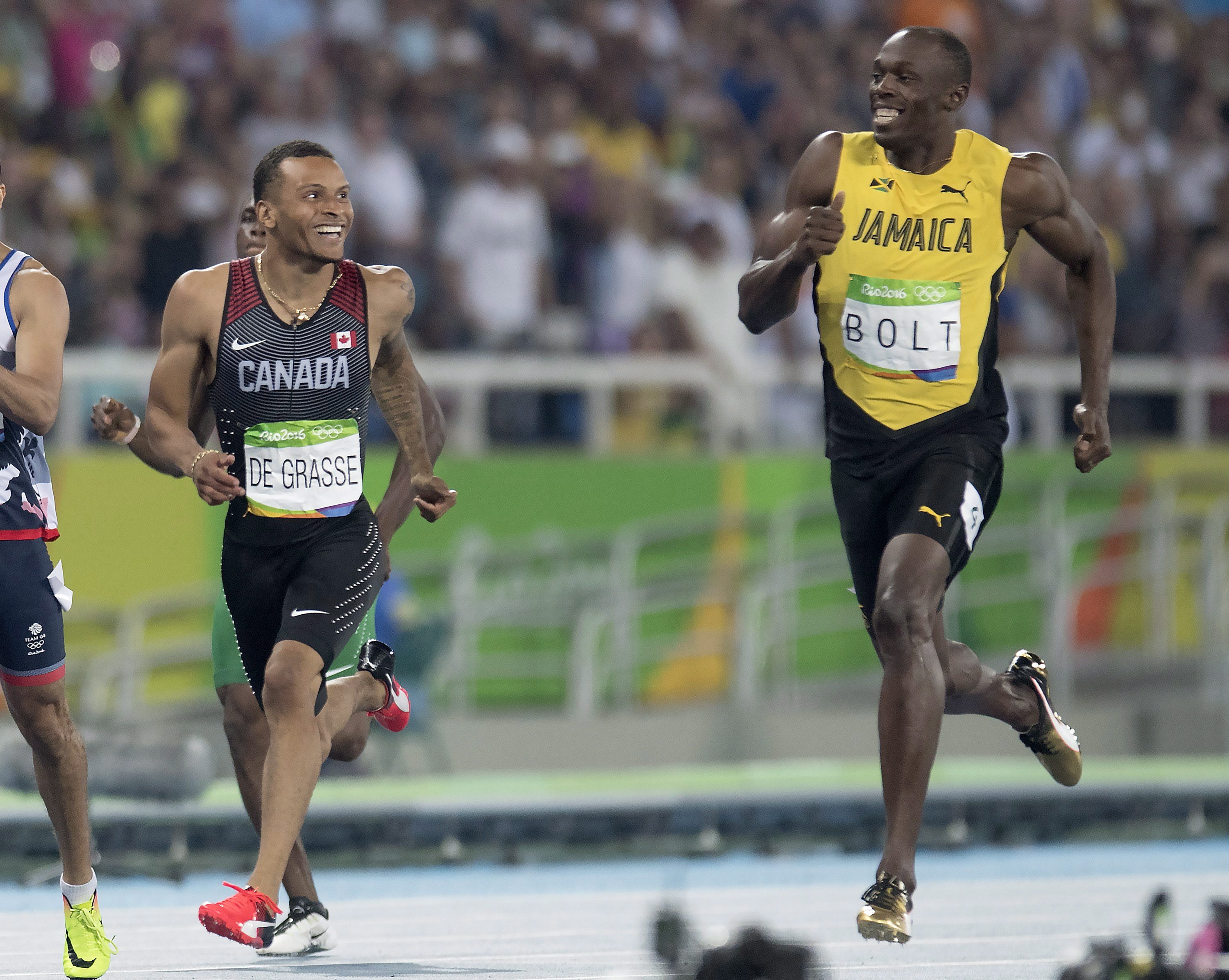 Canada's Andre De Grasse (left) and Jamaica's Usain Bolt share a laugh before they pass the finish line as they set the two fastest times in the 200-metre semifinals at the Olympic games in Rio de Janeiro, Brazil, Wednesday August 17, 2016. THE CANADIAN PRESS/Frank Gunn