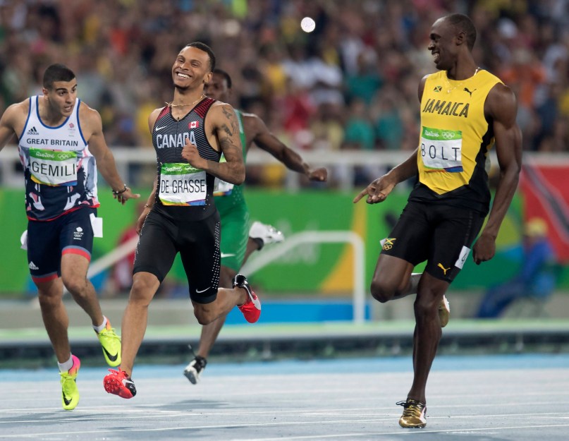 Canada's Andre De Grasse (left) and Jamaica's Usain Bolt share a laugh at the finish line as they set the two fastest times in the 200-metre semifinals at the Olympic games in Rio de Janeiro, Brazil, Wednesday August 17, 2016. THE CANADIAN PRESS/Frank Gunn
